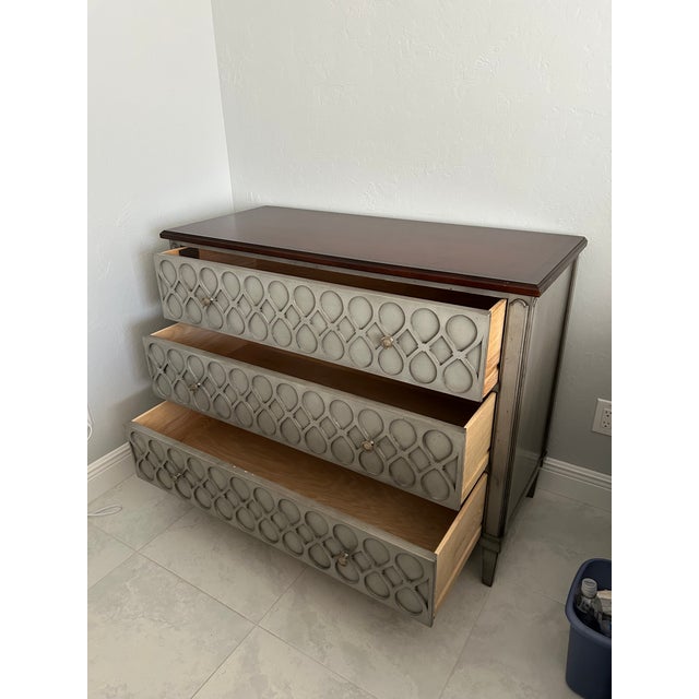 Original price of the item: $5,465.00 Figure 8 and diamond patterns carved along the front Three drawers with dual round...