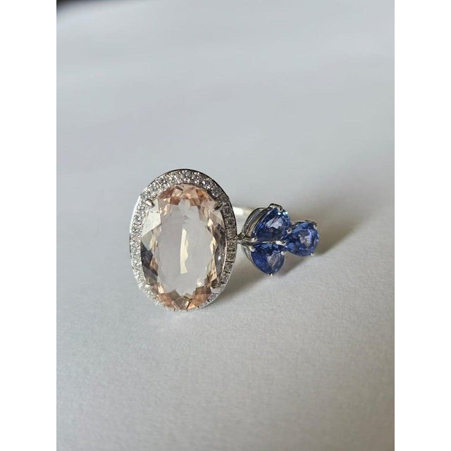 A very gorgeous and beautiful, modern style, Morganite & Blue Sapphires Cocktail Ring set in 18K Rose Gold & natural...