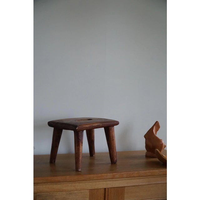 Decorative Scandinavian stool in solid pine. Hand carved by a Danish cabinetmaker in 1960s. An overall fine patina in this...