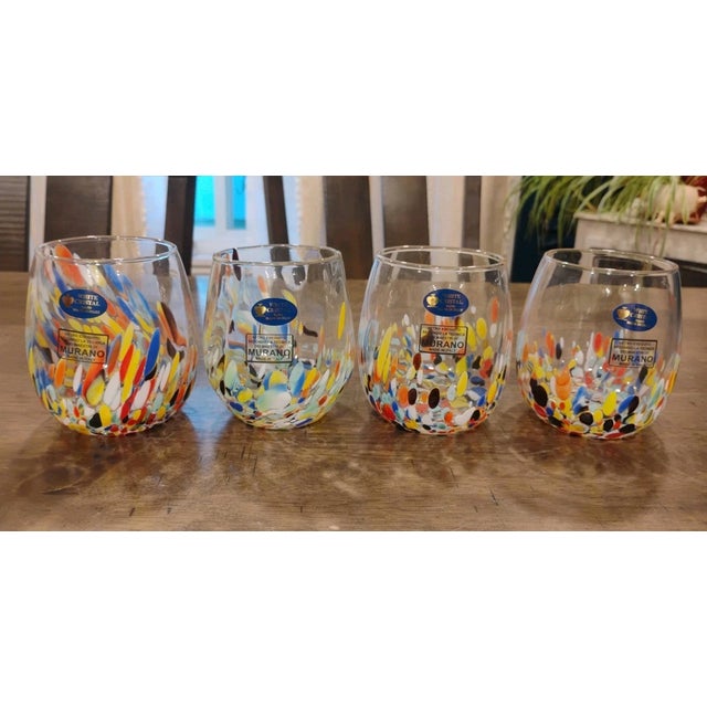 Add a vibrant touch of Italian artistry to your table with this beautiful set of four **White Cristal Confetti Glass...