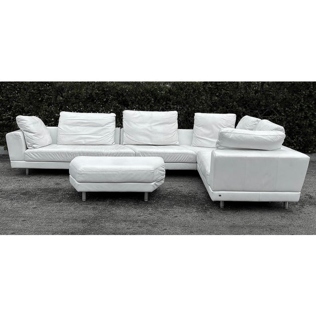 ROLF BENZ Leather Sectional Sofa and Ottoman with Glass Attached Side Table Offered for sale is a Rolf Benz leather...