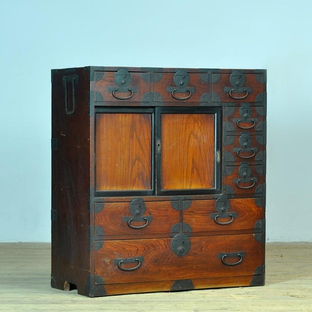 Traditional Japanese Tansu chest of drawers with sliding doors from the 1890s. Manufactured during the late Meiji era...