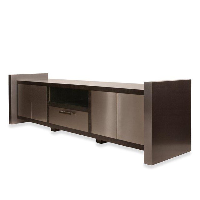 The Steve Hardy Custom Media Center showcases an exquisite blend of artistry and functionality, crafted with curly maple...