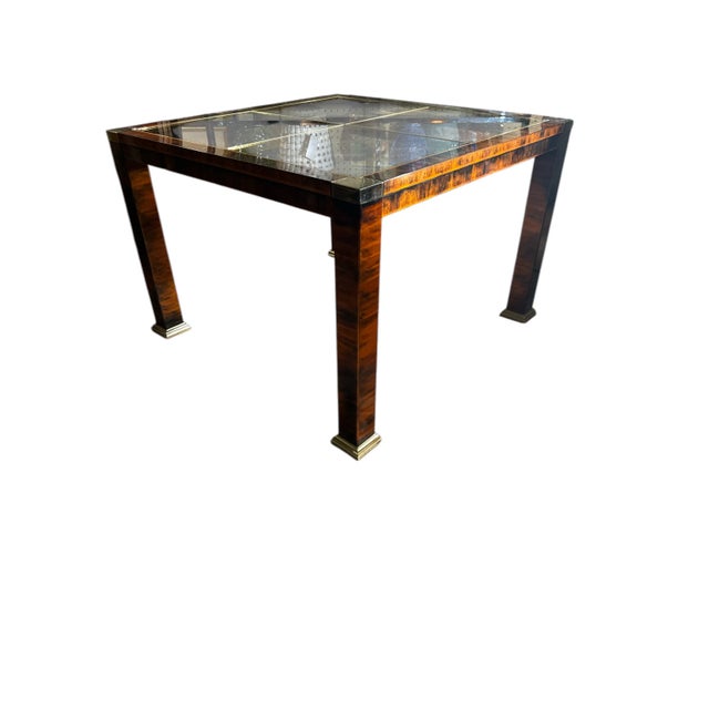 Gorgeous faux burled metal, and brass accented table. This table was designed by Mastercraft, and is a high quality piece....