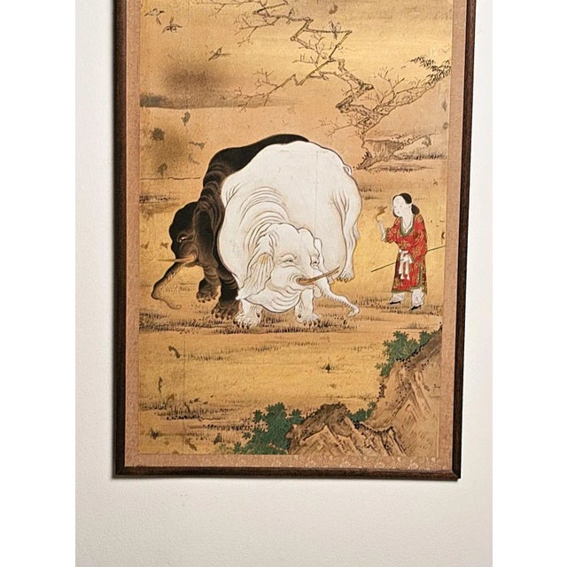 A large Meiji painting from the Kano school of a woman with black and white elephants, Japan circa 1870. One of a series...