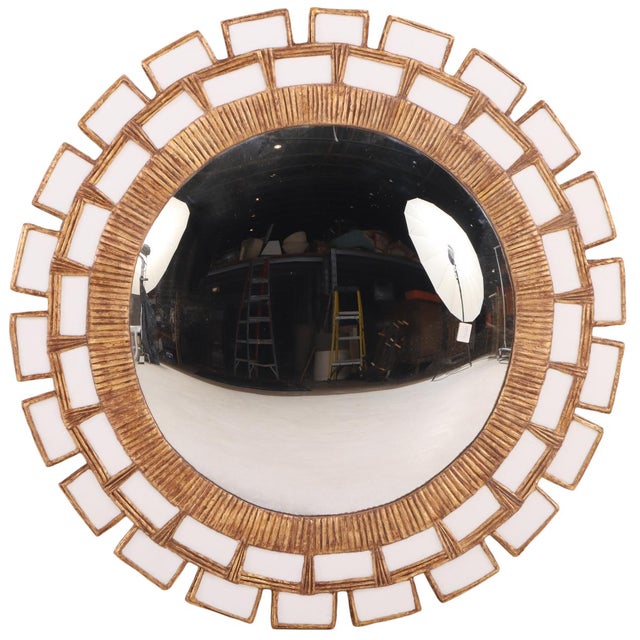 The textured white glass arranged in a geometric in the manner of Vautrin's "Mazarin" style. These mirrors are made by...