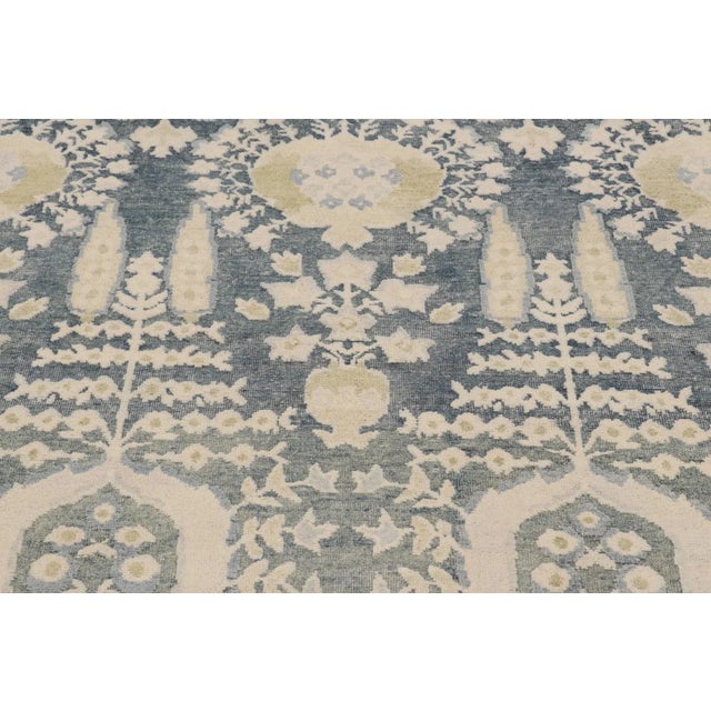 Hand-knotted in a luxurious blend of wool and silk, this 4x5 modern rug is a bold addition to Rug & Kilim’s Block Print...