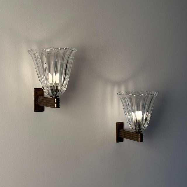 A remarkable pair of large wall sconces designed by ercole barovier for barovier & toso in the 1940s, showcasing the...