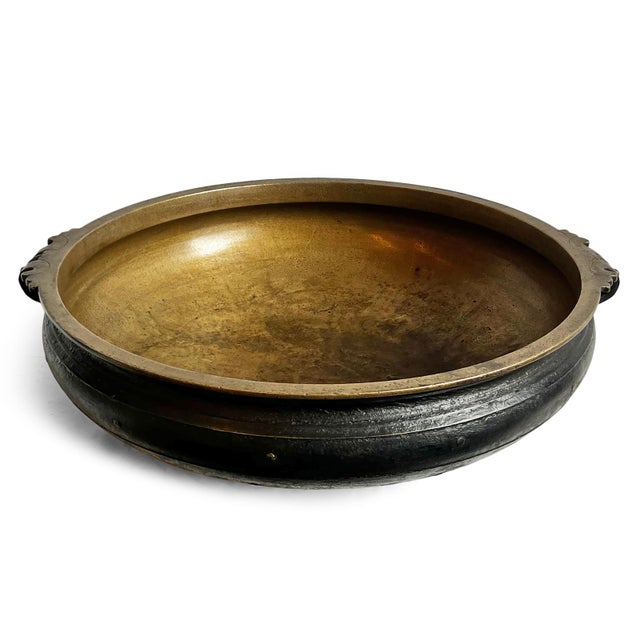 Antique solid bronze Urli bowl from India. These traditional bowls were used in Indian culture for rituals and festivals,...