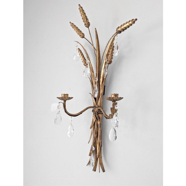 An authentic Mid Century Italian tole candle sconce with wheat motif and two candle holders.