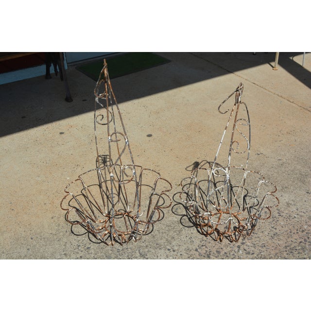 Great set of iron/metal hanging planters. Looks like they were white once as there are remnants of paint. They are not the...