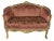 French handcrafted and gilded wood loveseat sofa circa 1950s. The sofa is upholstered with red and gold colour damask...