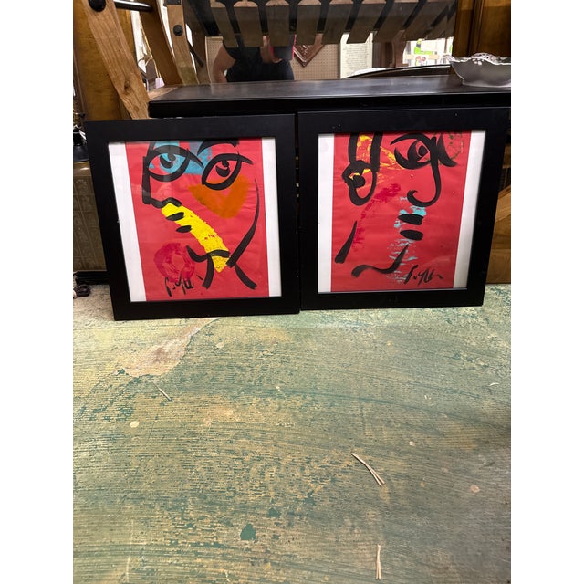Fantastic pair of colorful abstract paintings by Peter Keil. Each are painted on paper and depict colorful red cubist...