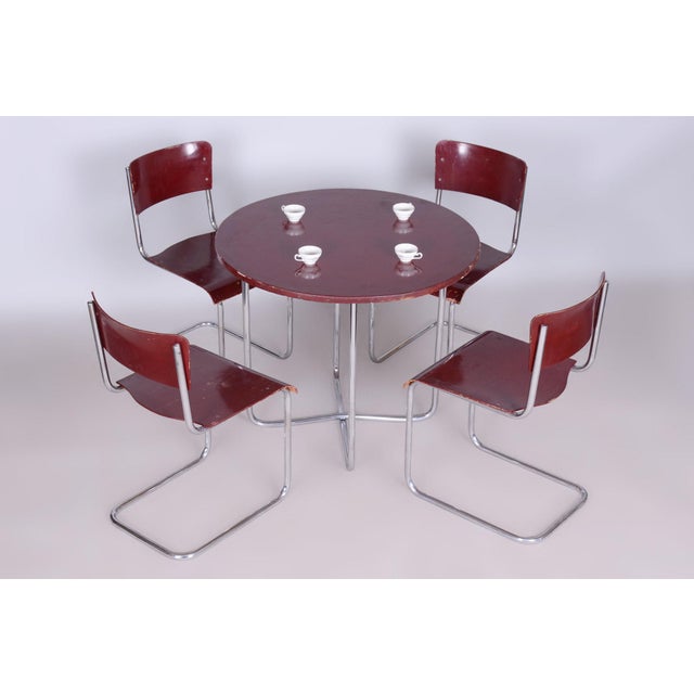 Dining table and 4 Chairs This elegant dining set from the Bauhaus period was crafted in Czechoslovakia by the renowned...
