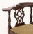 George III Mahogany Corner Chair, with openwork back splats, plaid beige upholstered drop seat on four legs conjoined by...