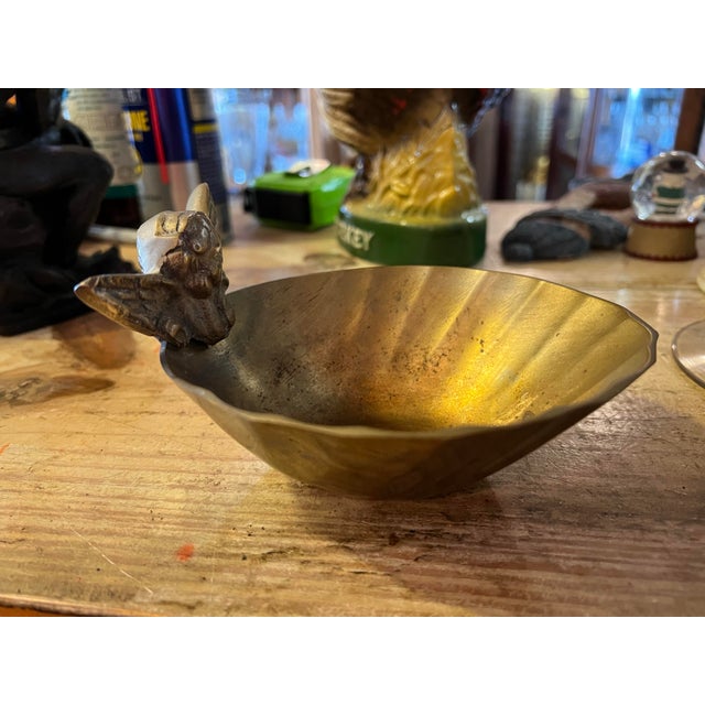 Solid brass trinket bowl. Made in India. Has a cherub / angel on the rim.