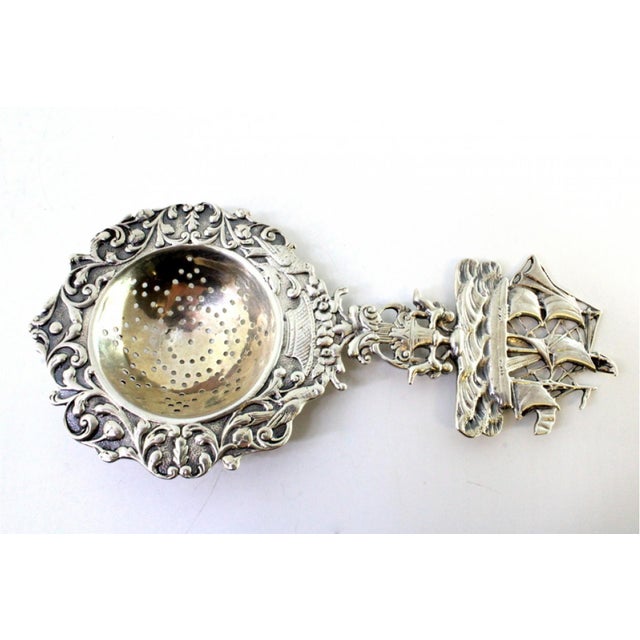 Silver Tea Strainer with Reliefs, Applications and Caravel Cut-Out Handle For Sale - Image 3 of 8