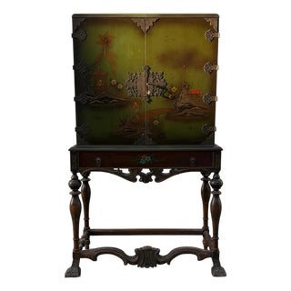 Vintage Chinoiserie Green Lacquer Cabinet With Hand Painted Asian Scenes and Ornate Carved Base For Sale