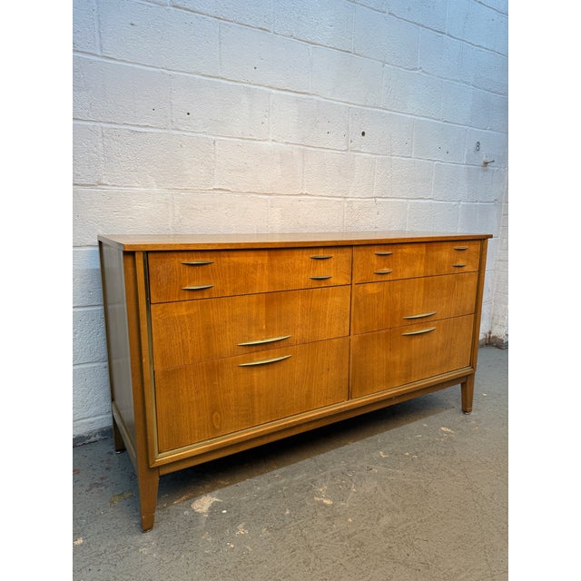 Elegant mid-century modern six-drawer lowboy dresser by West Michigan Furniture Co., showcasing the timeless combination...