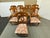Design Plus Gallery presents a Set of Eight Fiddleback Splat Vintage Dining Chairs. The chairs have a medium, honey brown...