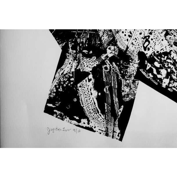 An abstract, black and white lithograph contained in an interesting shape enclosed by clean negative space. Signed L....