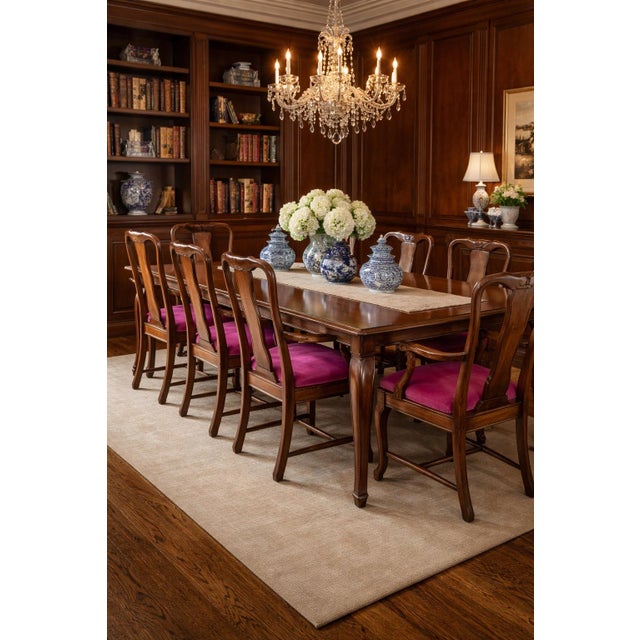 A refined and highly decorative dining set from the Guy Chaddock Almont Collection, comprising a stunning parquetry-top...