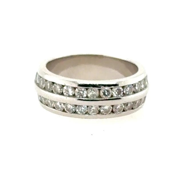 Platinum band with 56 round diamonds weighing approximately 2.50 carats. 11.43g Size 6.5
