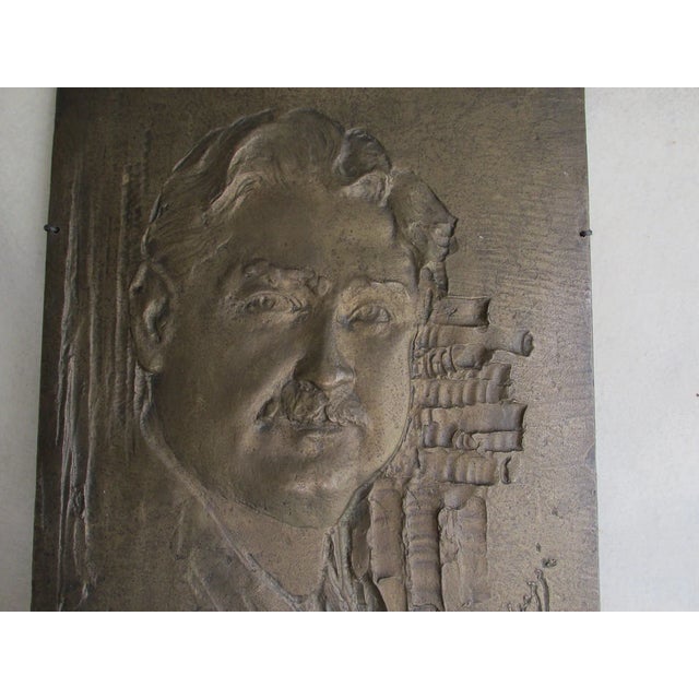 An Antique Bronze Plaque depicting a Gentleman with a Mustache and Curly Hair. The Sculpture is well done, it is signed...