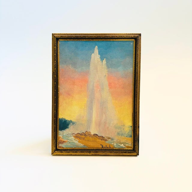 A small vintage painting on board of a colorful geyser. Signed on the bottom. Framed in a brass frame with velvet backing....