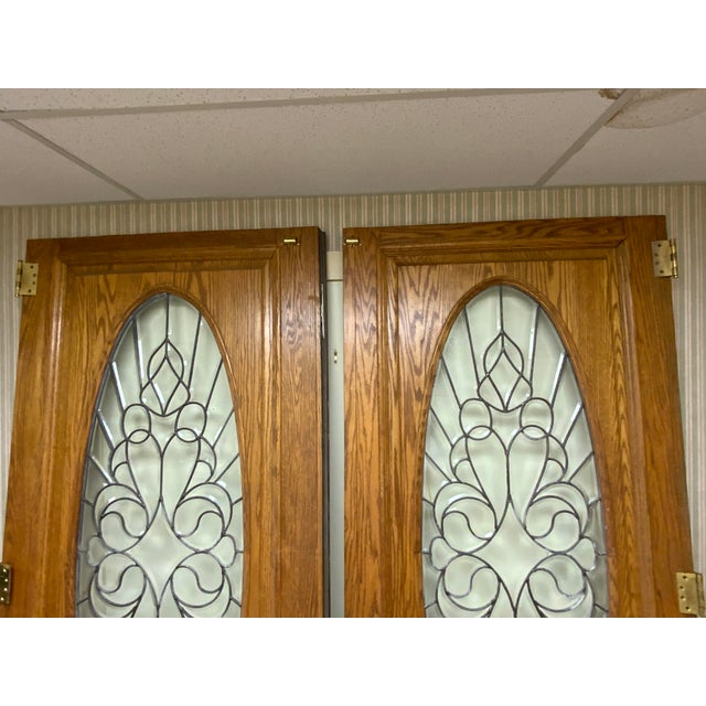 Wood French doors with leaded glass, brass hardware. One side 36 1/4” and door with lip molding measures 37 1/2”