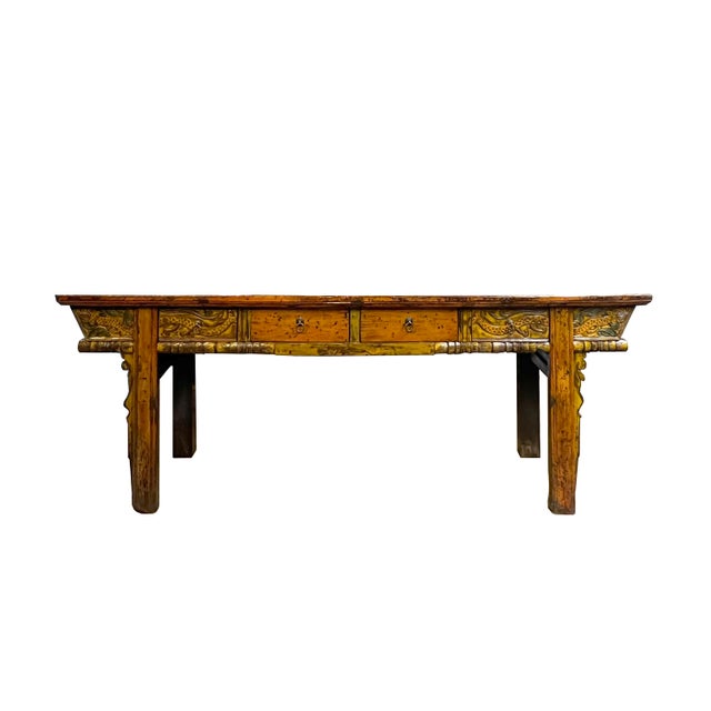 This striking console table captures a sense of storied history through its vintage, distressed aesthetic and vibrant,...