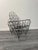 An extraordinary sculptural armchair intricately crafted from iron and string by the acclaimed French artist Gerard...