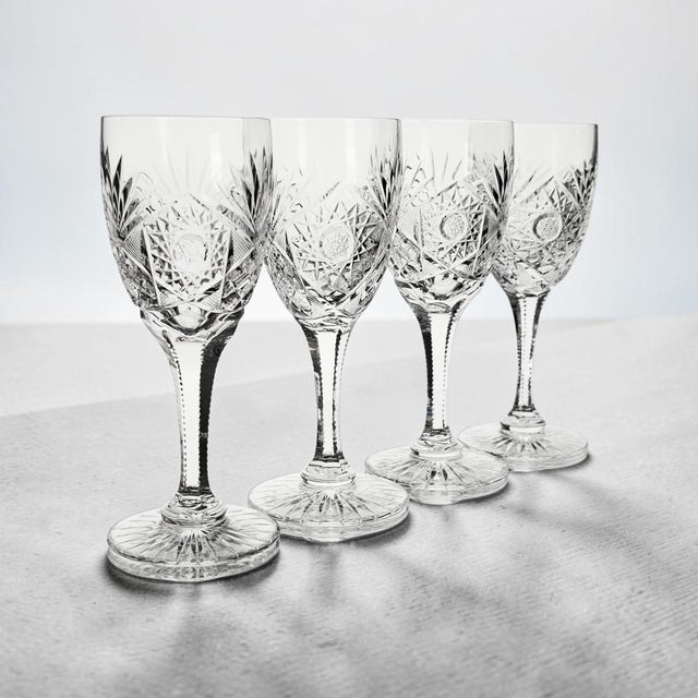 This set of four Kusak Cut Glass Works Chantilly Lace water goblets was produced in Germany during the Late 20th Century....