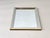 This wall mirror impresses with its clear geometry and elegant, minimalist design. The rectangular frame is made of...