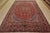 An authentic vintage traditional Mashad rug hand-knotted with fine wool and natural dyes. This rug features a central...