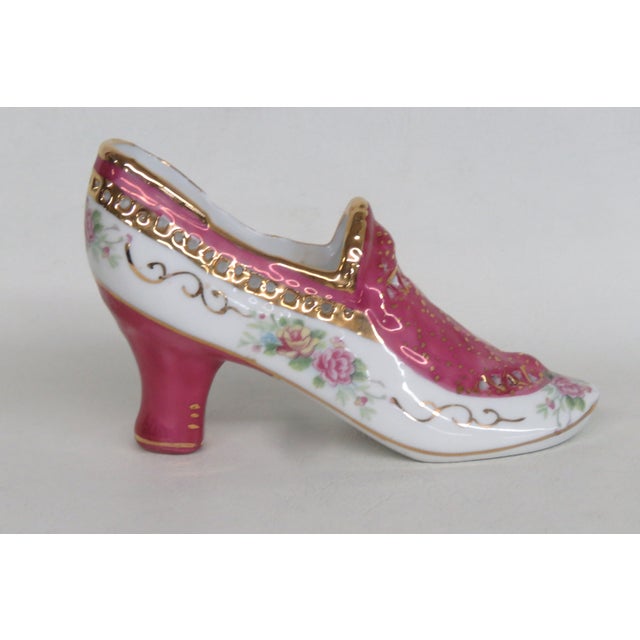 This gorgeous Heeled Shoe Figurine is made out of porcelain. This wonderful decorative figure depicts of a Victorian style...