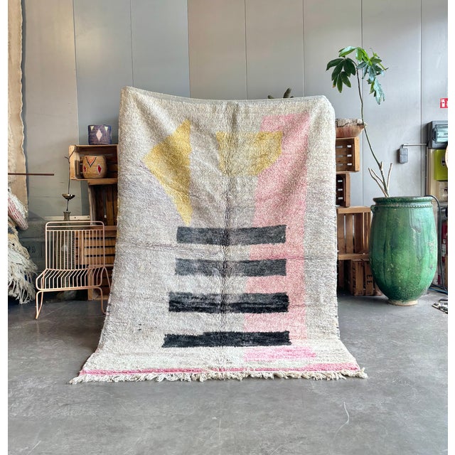 Handmade Boujad Moroccan rug featuring a bold abstract geometric composition with soft pastel tones and graphic artistic...