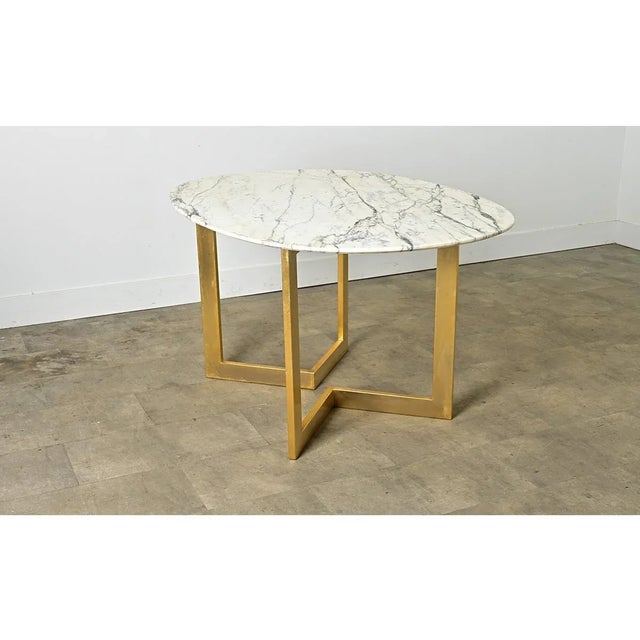 Dimensions: 29” H x 54 ¾” W x 39 ⅛” D A striking contemporary French marble dining table that might also double as an...