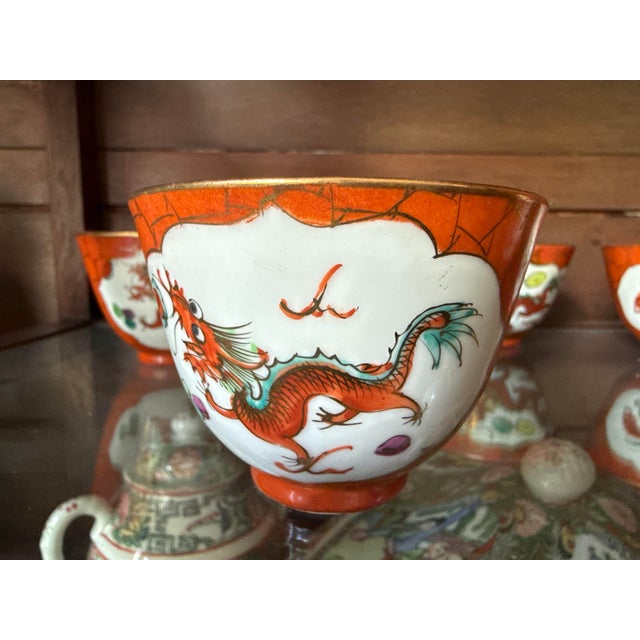 Set of 6 Beautiful Chinese porcelain ginger tea cups. Orange, white with painted dragon and Phoenix with gold painted...