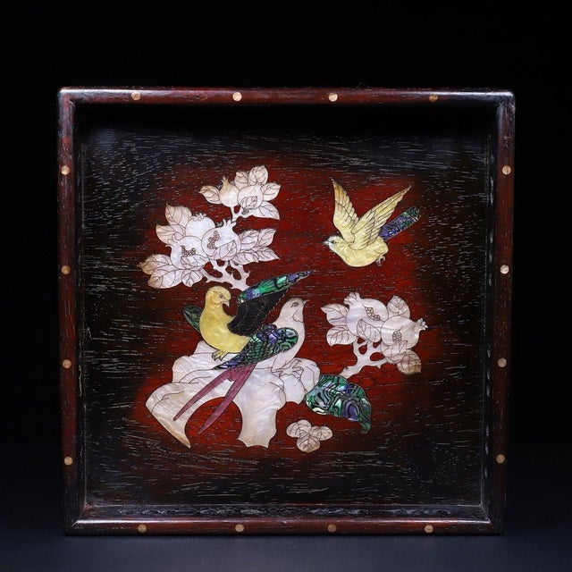 This is an exquisitely crafted square wooden tray featuring intricate mother-of-pearl (nacre) inlay work. Crafted from a...