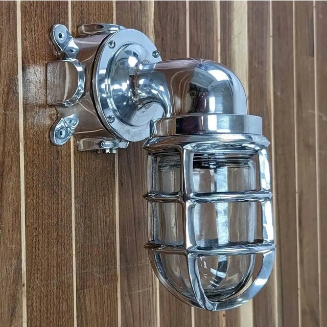 This Nautical Wall Sconce is made of aluminum and features a clear globe with no cover. It offers durable and lightweight...