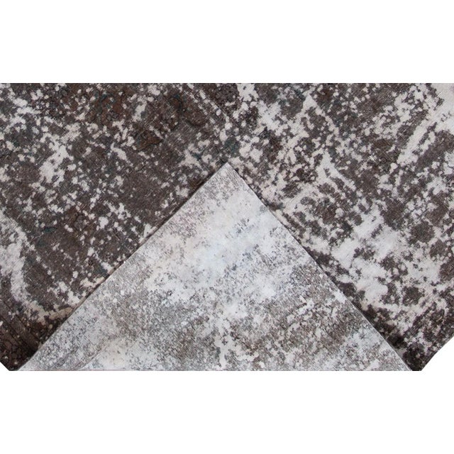 Beautiful hand-knotted vintage wool rug with a brown field. This distressed rug has gray accents featuring an all-over...