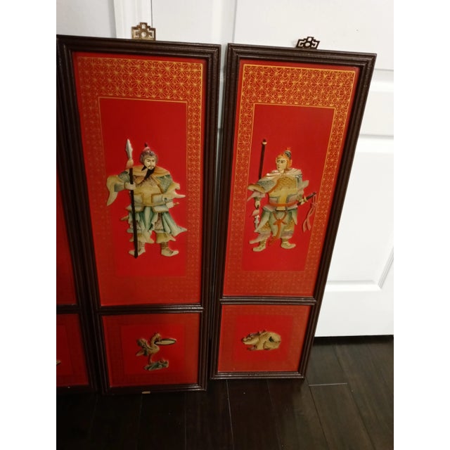 A gorgeous set of 4 Chinese Emperor decorative wall panels. The panels are incredibly striking in a vibrant bright red...