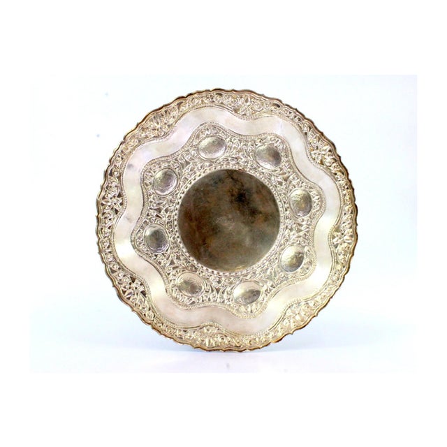 Silver Tray with Floral and Animal Motifs in Relief, in Very Good conditions. Designed from 2000 This piece has an...