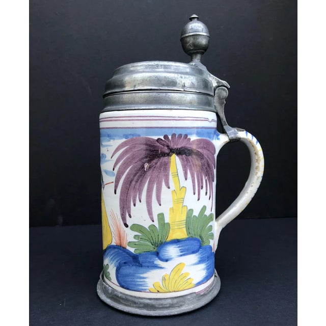 This tankard from the 3rd quarter 18th century is of cylindrical form with the handle mounted in pewter. The place of...