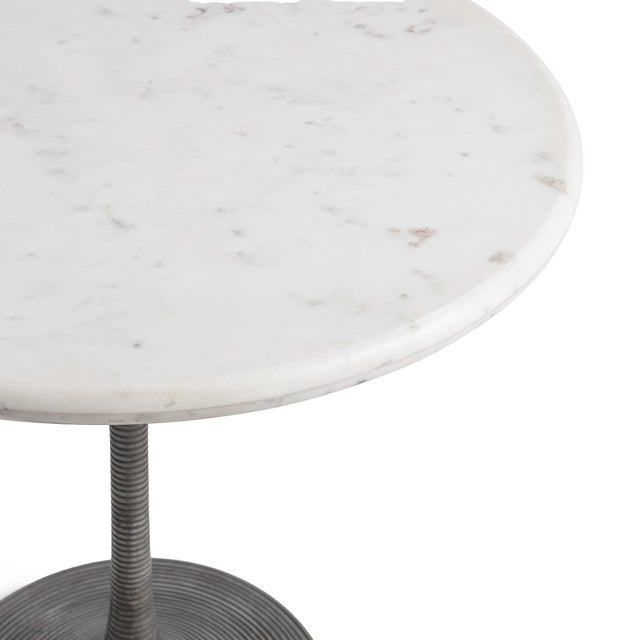 Elevate your patio, garden, or dining space with this elegant indoor-outdoor round marble bistro table, featuring a white...
