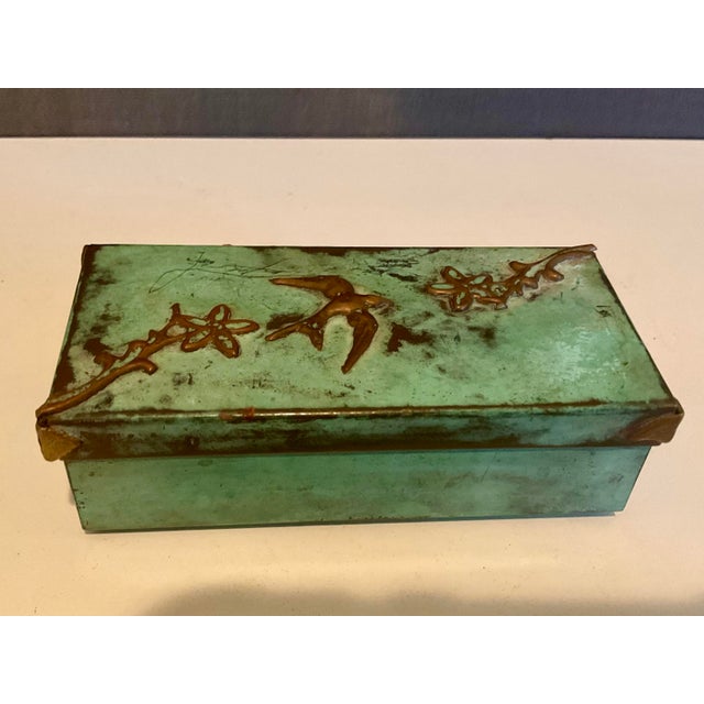 Beautiful vintage copper box featuring a natural green patina and raised bird and floral motifs on the lid. Signed and...