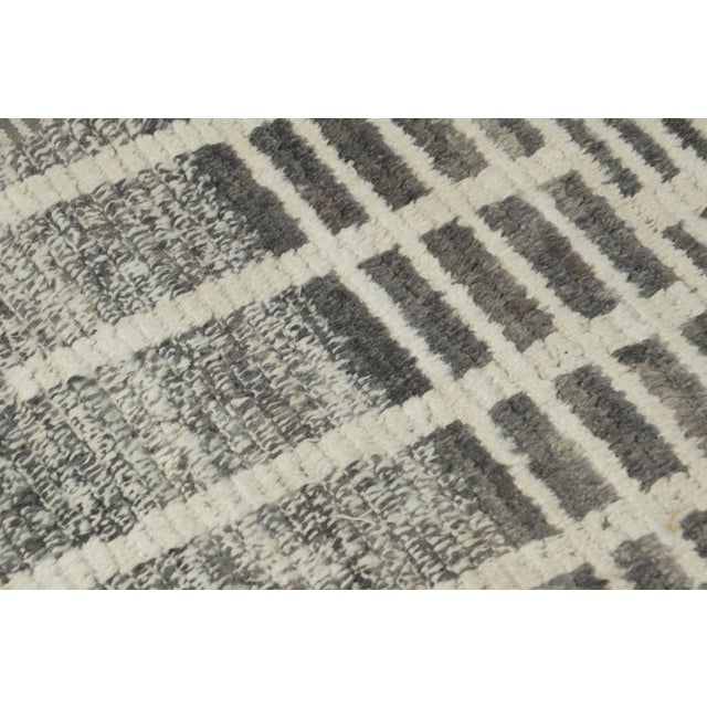 Hand-knotted in wool as a gift-sized rug, this 2x3 contemporary geometric rug joins Rug & Kilim’s Modern collection....
