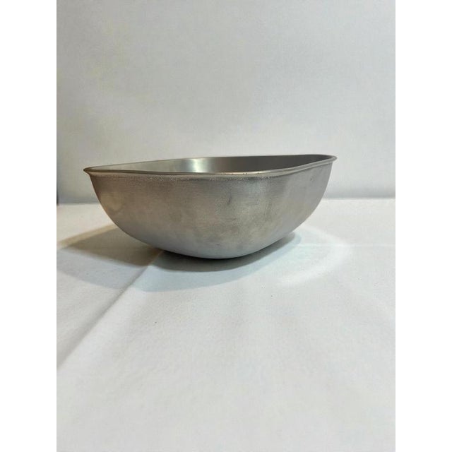 A sculptural swedish pewter bowl designed by edvin ollers and produced by schreuder & olsson, stockholm, in 1938. The bowl...