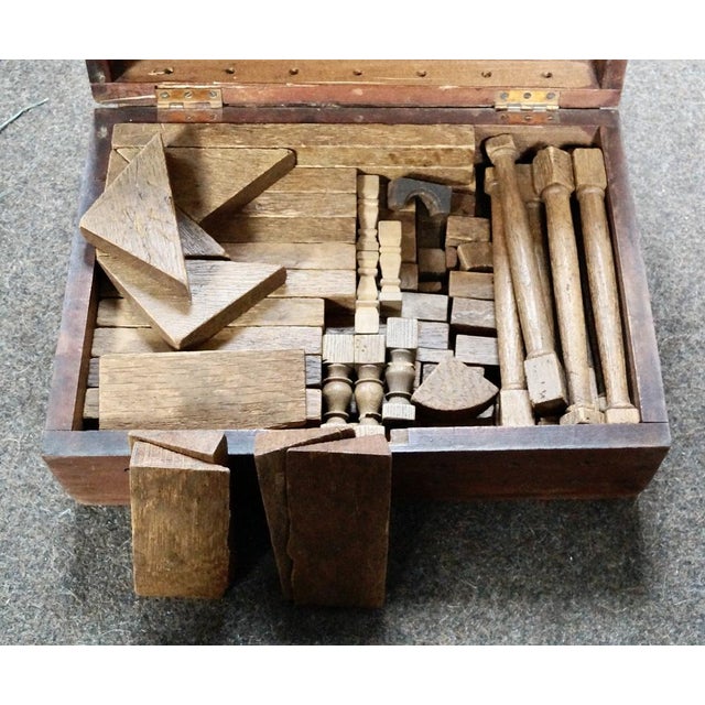 This set of antique wooden architectural building blocks in the original wooden box is an amazing piece. The wooden box is...